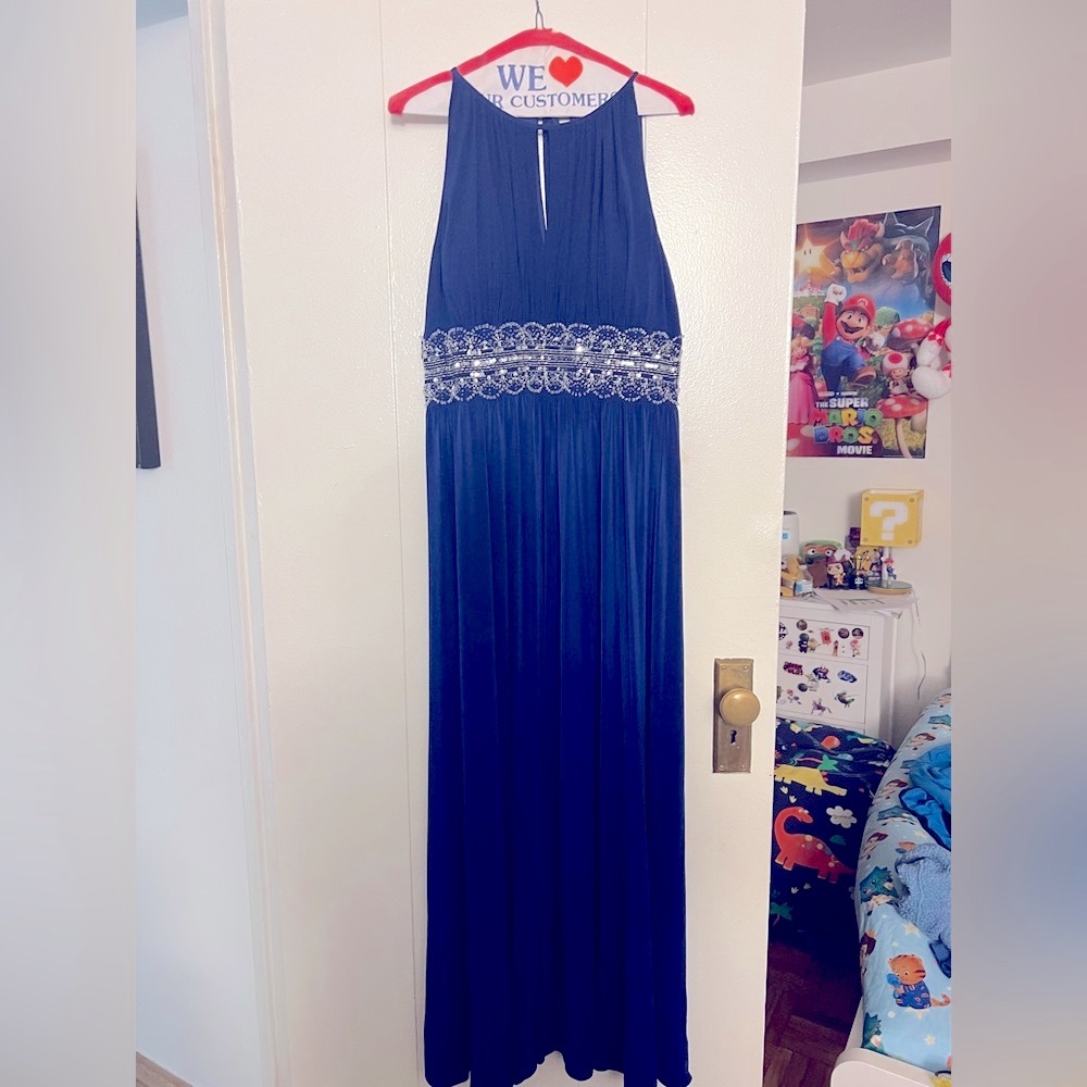 RM Richard’s gown royal blue color it is size 14P also has been hemmed.